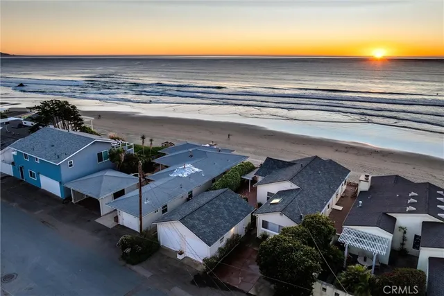 a view of a house with floor to ceiling windows and a basket ball poll