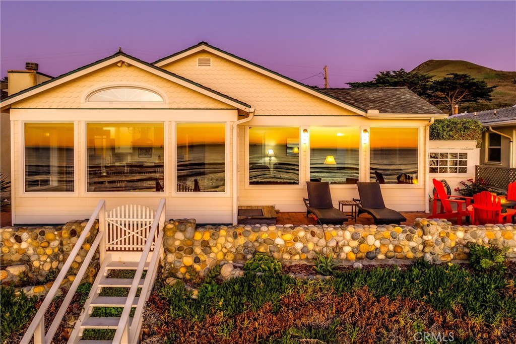 2850 Studio Drive Cayucos, CA 93430 - Photo 42 of 54 a view of a house with floor to ceiling windows and a basket ball poll