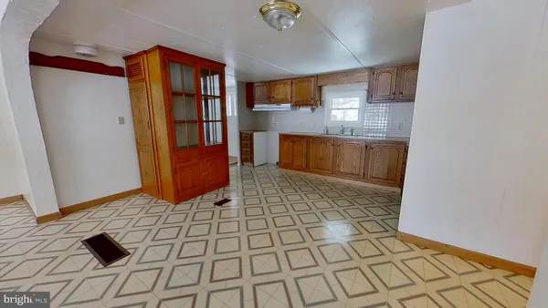 a view of kitchen with furniture and window