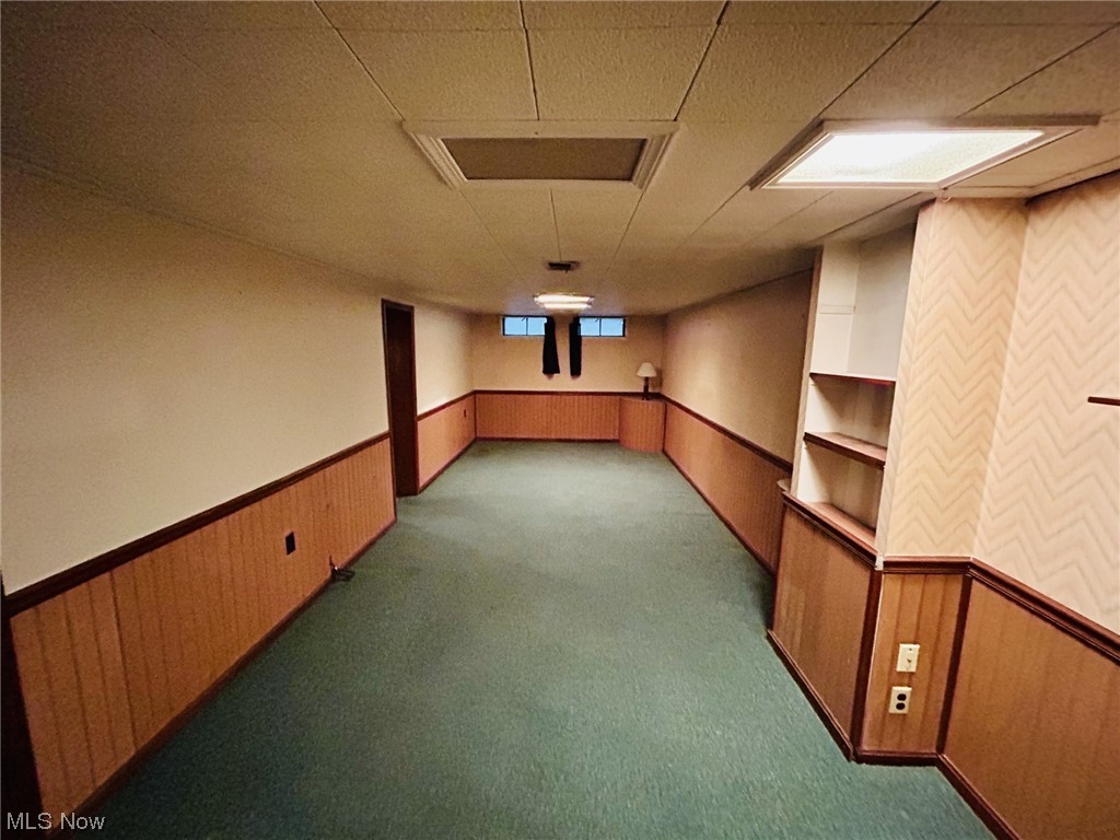 13414 Rockside Road Garfield Heights, OH 44125 - Photo 16 of 25 Basement with dark carpet and a drop ceiling