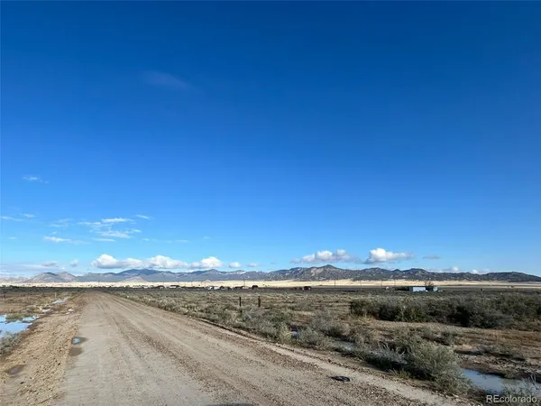 a view of an ocean beach and mountain