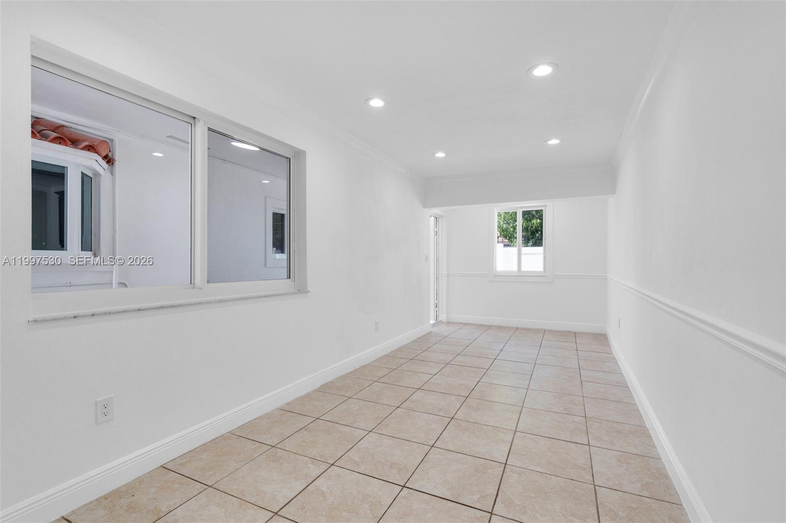 201 Southwest 51st Court, Unit 2 Miami, FL 33134 - Photo 2 of 10 a view of an empty room and window