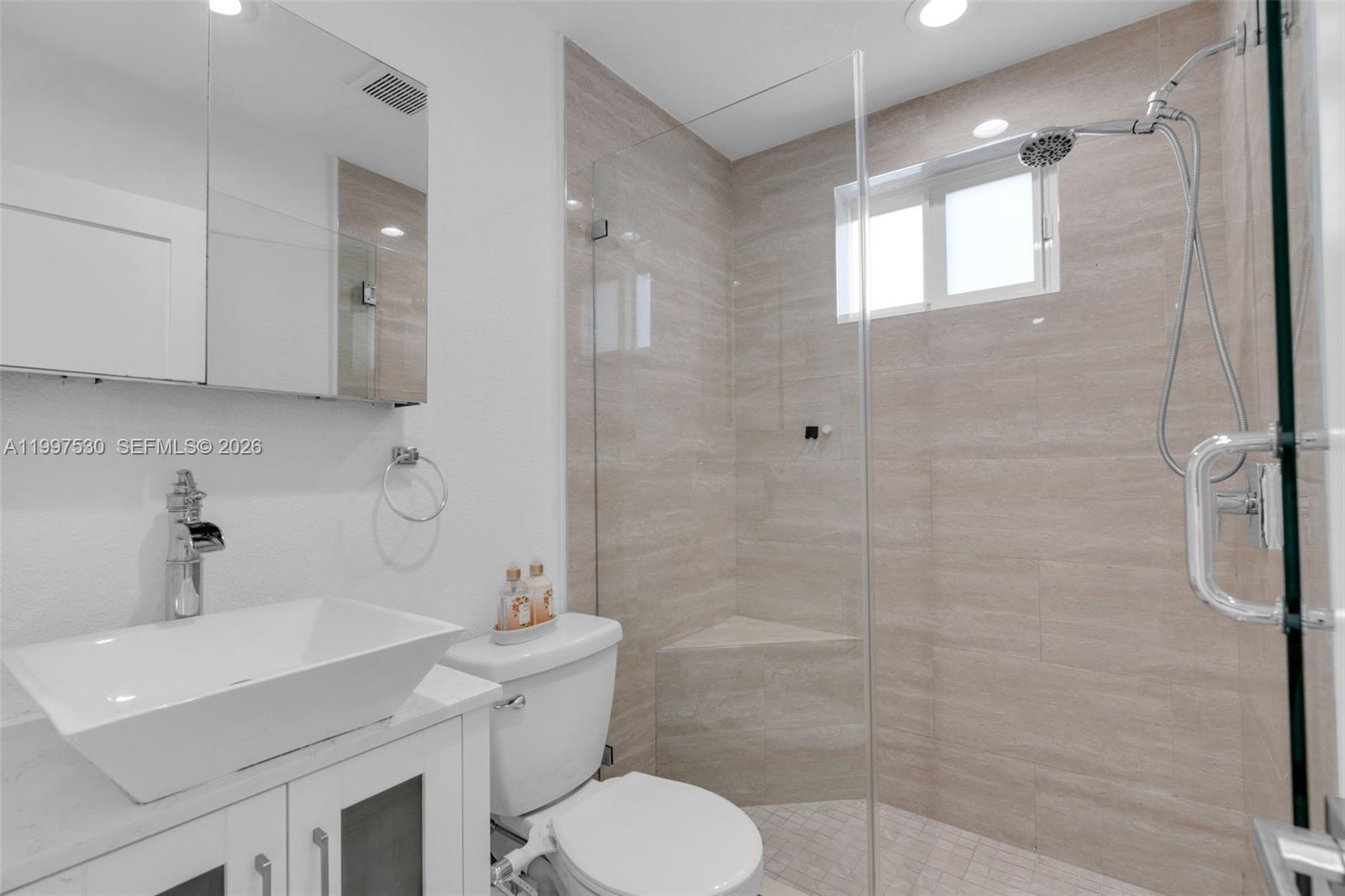 201 Southwest 51st Court, Unit 2 Miami, FL 33134 - Photo 10 of 10 a bathroom with a sink toilet and shower