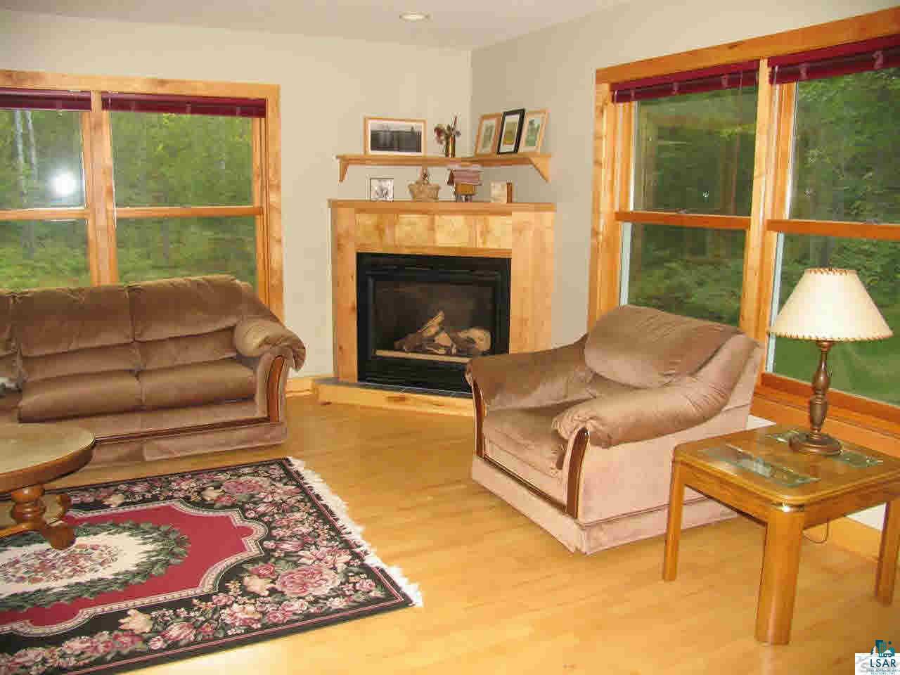 16630 Sand Hill Road Mason, WI 54856 - Photo 5 of 25 Living room with gas burning fireplace