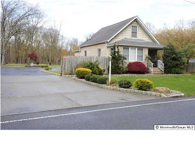 114 Bergerville Road Freehold, NJ 07728 - Photo 1 of 18 a black and white photo of a house