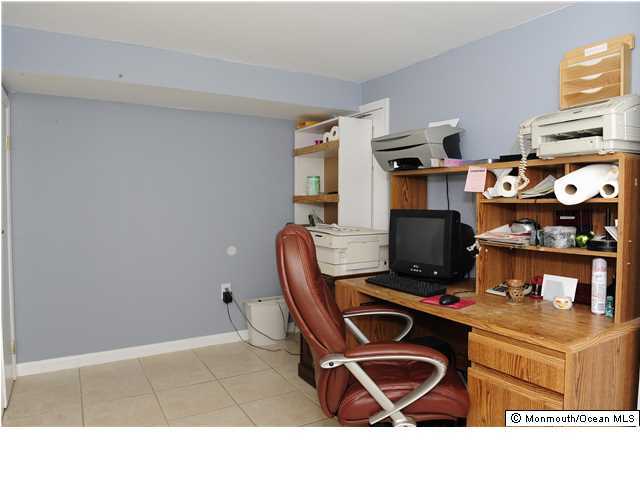114 Bergerville Road Freehold, NJ 07728 - Photo 15 of 18 a living room with furniture a rug and a window