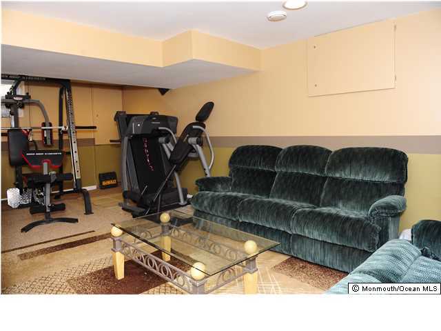 114 Bergerville Road Freehold, NJ 07728 - Photo 16 of 18 a room with furniture a air conditioner and a window