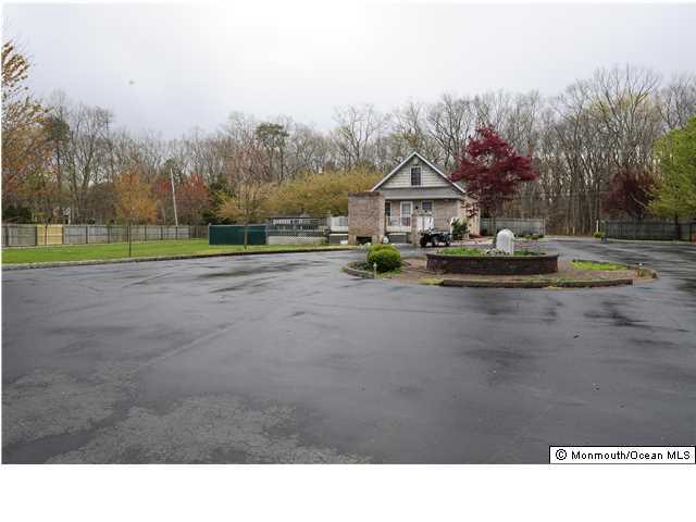 114 Bergerville Road Freehold, NJ 07728 - Photo 2 of 18 a backyard of a house with table and chairs