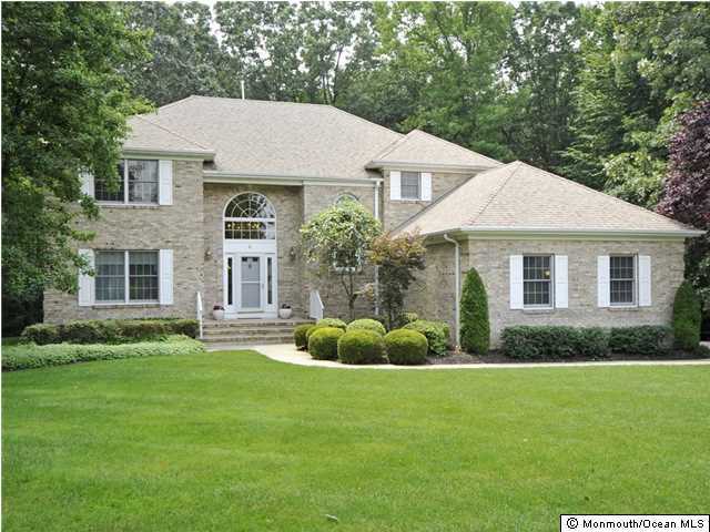 4 Seaman Road Freehold, NJ 07728 - Photo 1 of 13 a aerial view of a house with a yard patio and fire pit