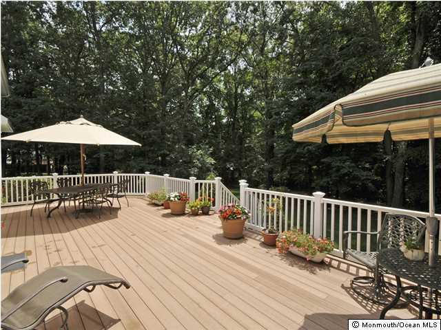 4 Seaman Road Freehold, NJ 07728 - Photo 11 of 13 a view of balcony with wooden floor and outdoor seating