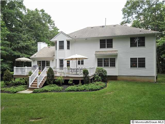 4 Seaman Road Freehold, NJ 07728 - Photo 12 of 13 a front view of a house with a yard and porch