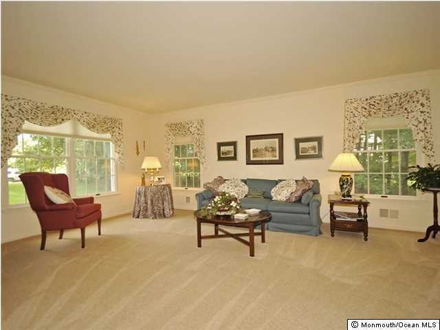 4 Seaman Road Freehold, NJ 07728 - Photo 3 of 13 a living room with furniture and a large window