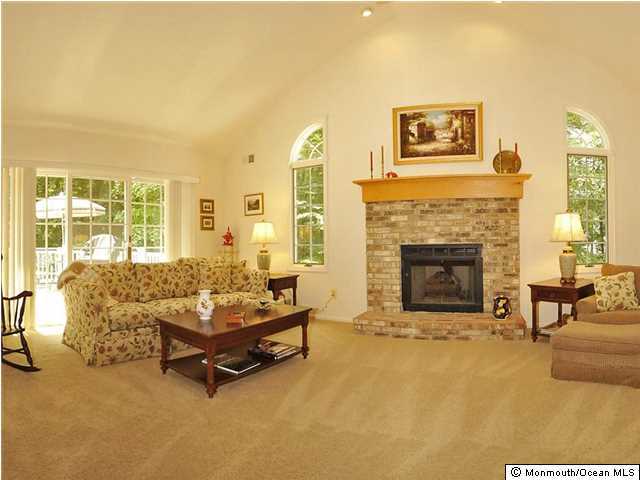 4 Seaman Road Freehold, NJ 07728 - Photo 4 of 13 a living room with furniture and a fireplace
