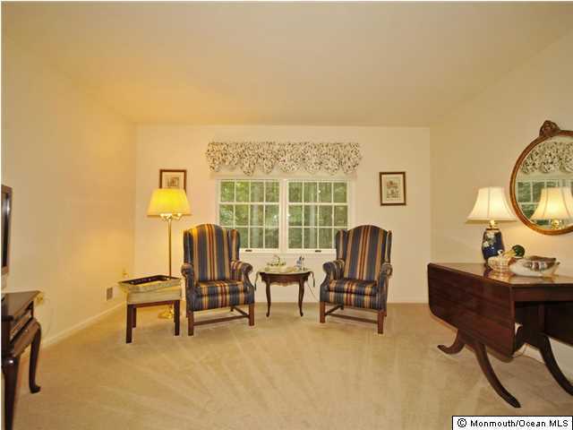 4 Seaman Road Freehold, NJ 07728 - Photo 7 of 13 a view of a livingroom with furniture and a window