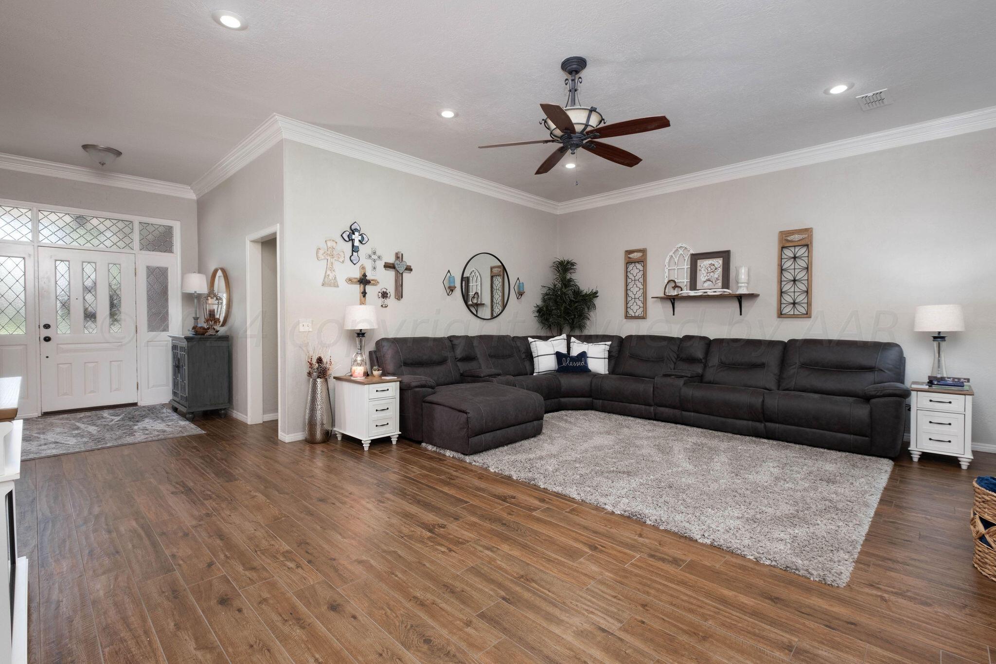 4400 Baltus Place Amarillo, TX 79121 - Photo 11 of 39 a living room with furniture and a wooden floor