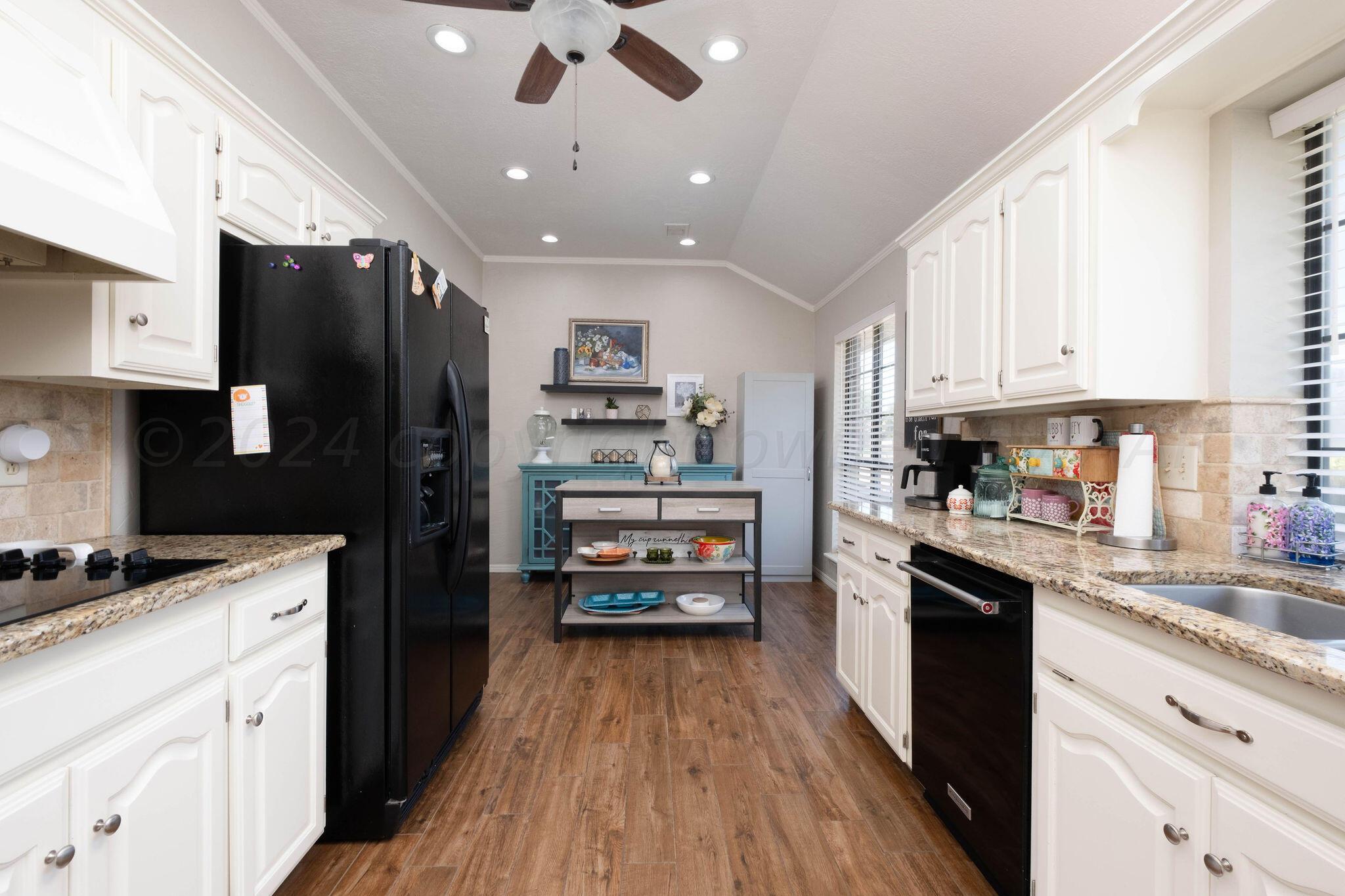 4400 Baltus Place Amarillo, TX 79121 - Photo 15 of 39 a kitchen with stainless steel appliances a refrigerator sink and microwave