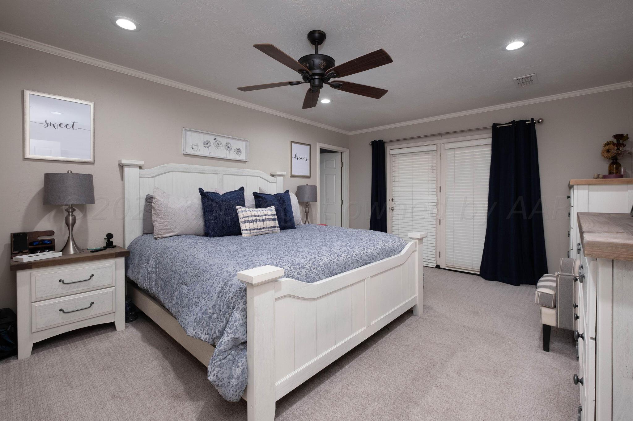 4400 Baltus Place Amarillo, TX 79121 - Photo 19 of 39 a bedroom with a bed and a ceiling fan
