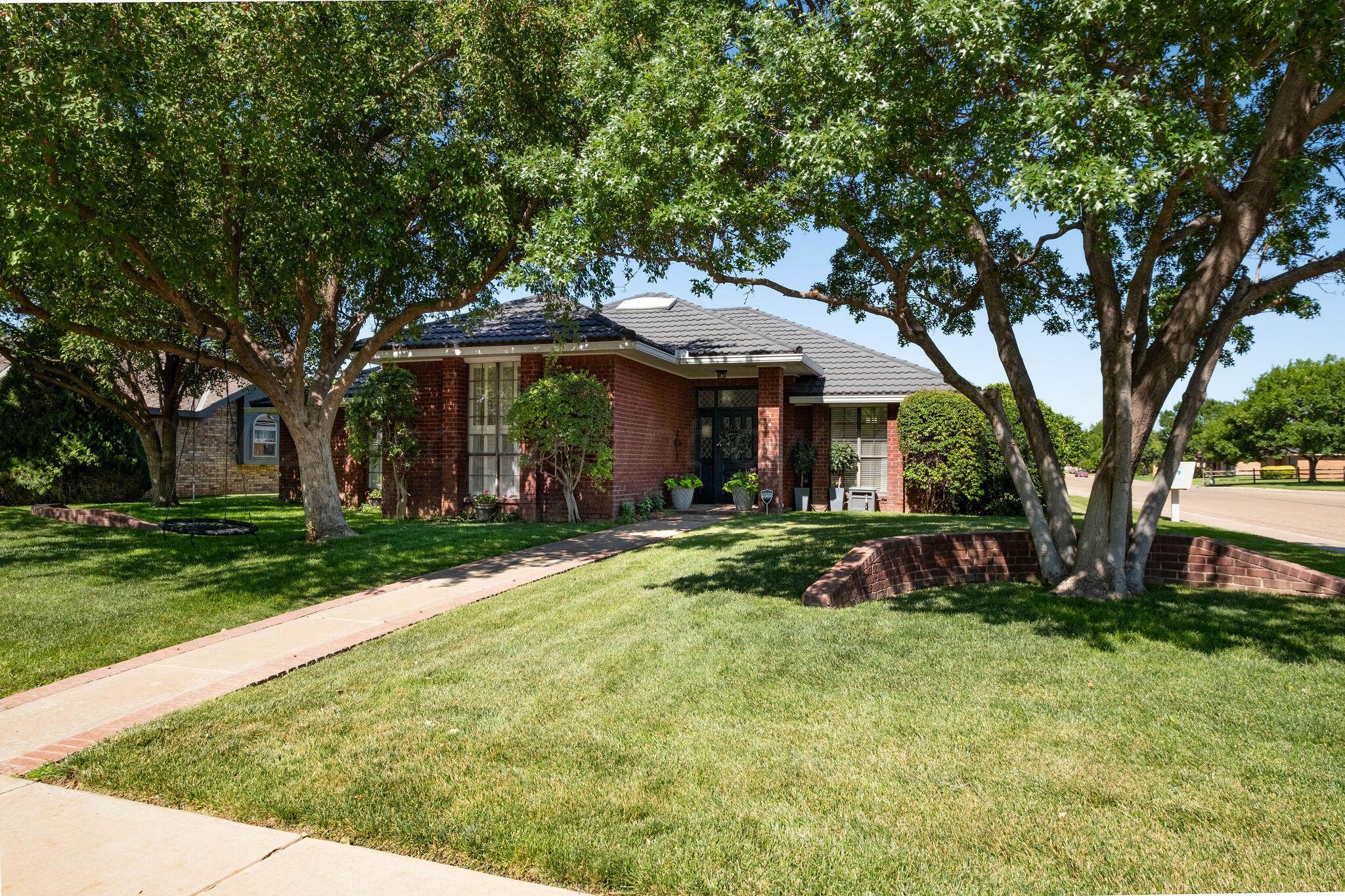 4400 Baltus Place Amarillo, TX 79121 - Photo 2 of 39 a front view of a house with garden