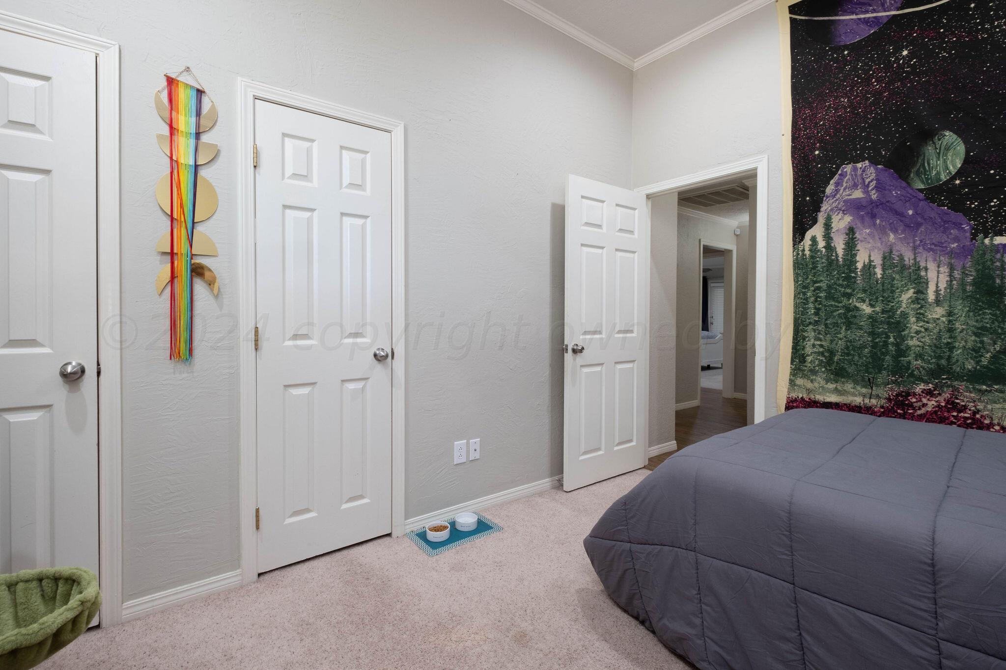 4400 Baltus Place Amarillo, TX 79121 - Photo 29 of 39 a bedroom with a bed and a painting on the wall