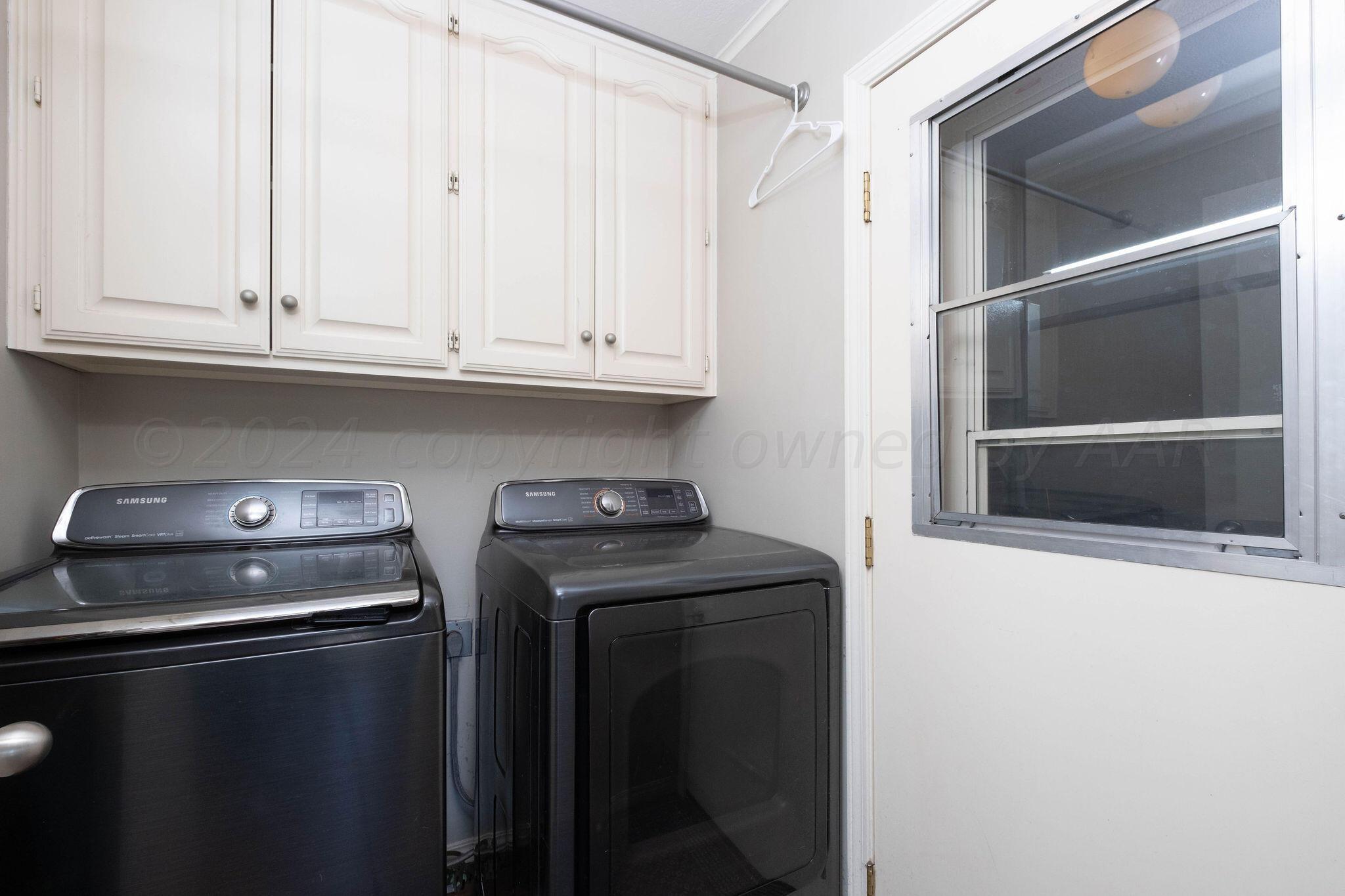 4400 Baltus Place Amarillo, TX 79121 - Photo 35 of 39 a kitchen with granite countertop white cabinets and a stove with a sink