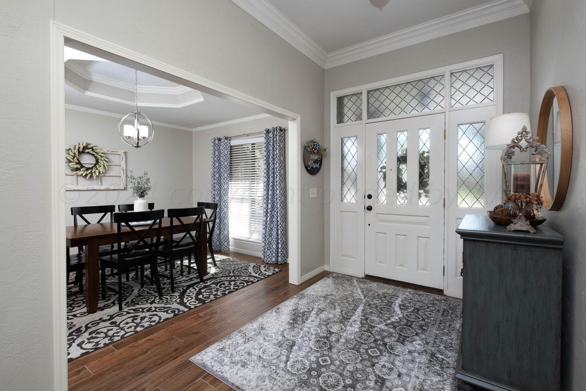 4400 Baltus Place Amarillo, TX 79121 - Photo 7 of 39 a view of a dining room with furniture and wooden floor