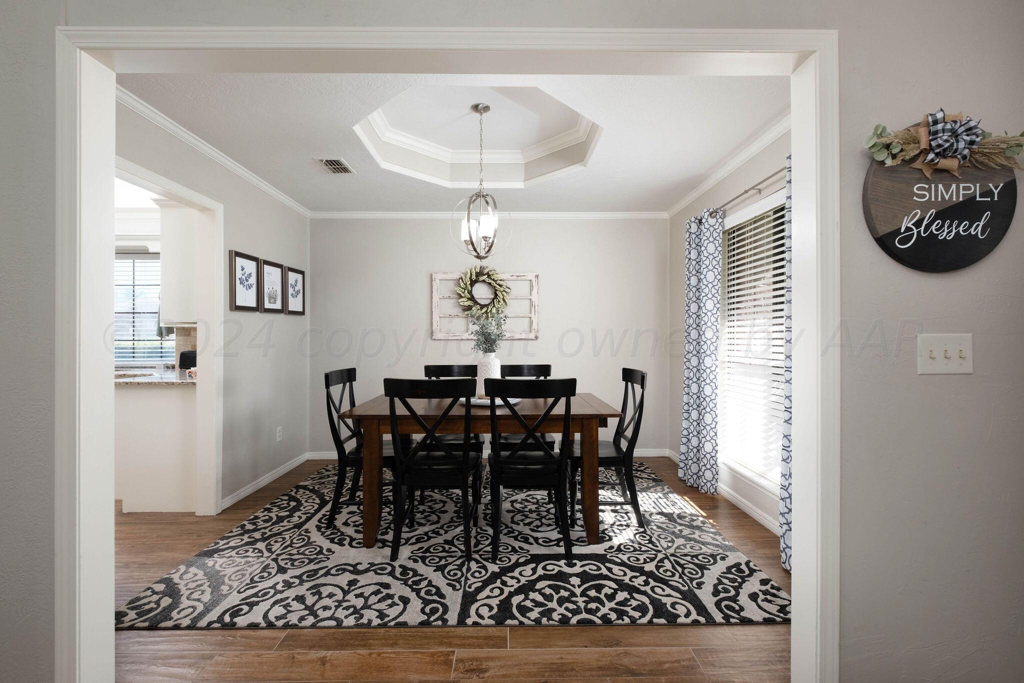 4400 Baltus Place Amarillo, TX 79121 - Photo 8 of 39 a view of a dining room with furniture and chandelier