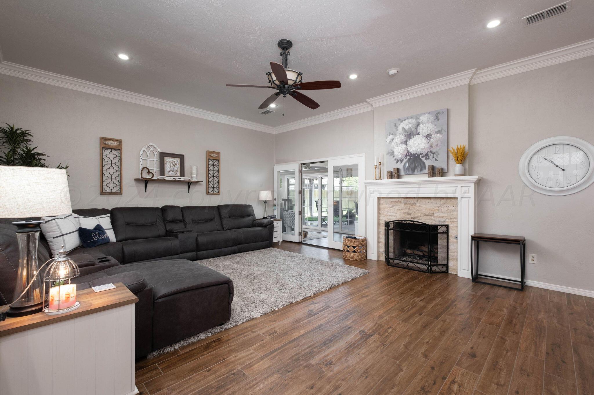 4400 Baltus Place Amarillo, TX 79121 - Photo 9 of 39 a living room with furniture and a fireplace