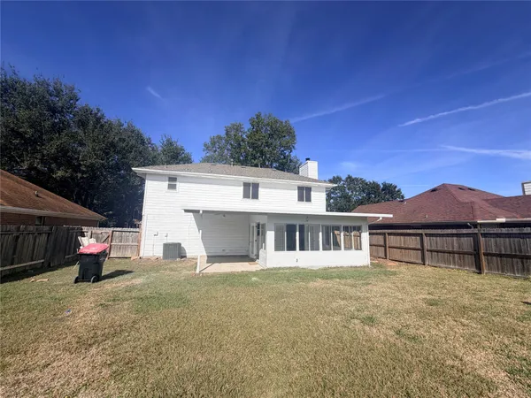 a house with trees in the background