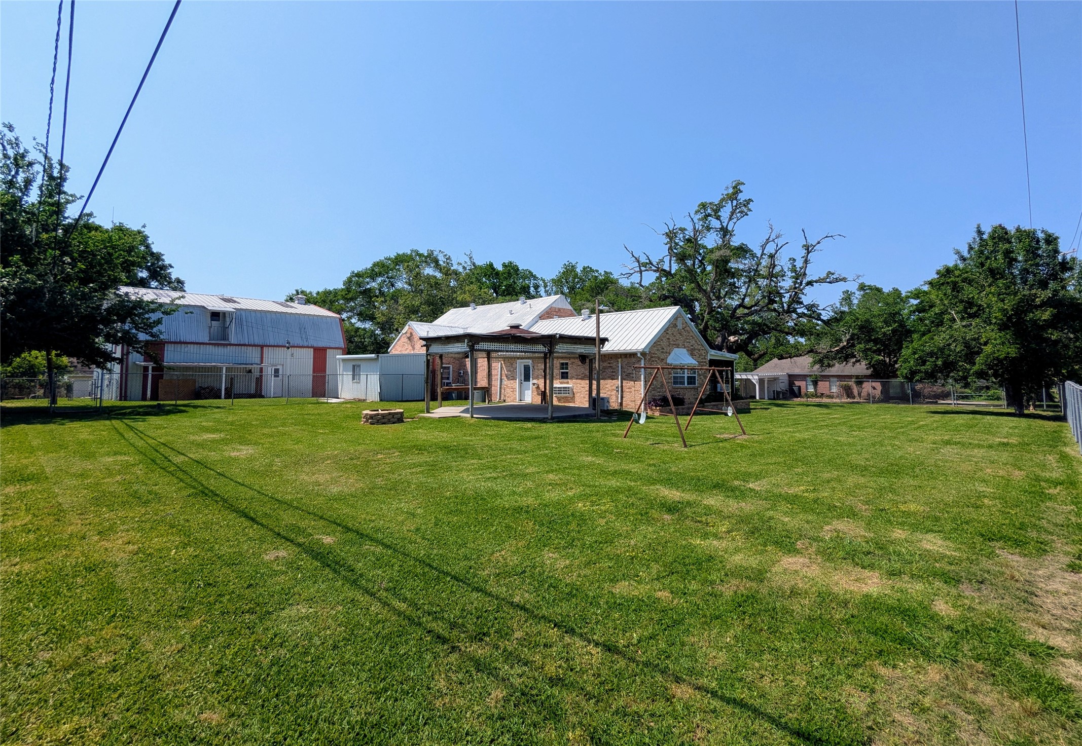 2654 Cos Street Liberty, TX 77575 - Photo 11 of 40 a view of a house with a big yard and large trees