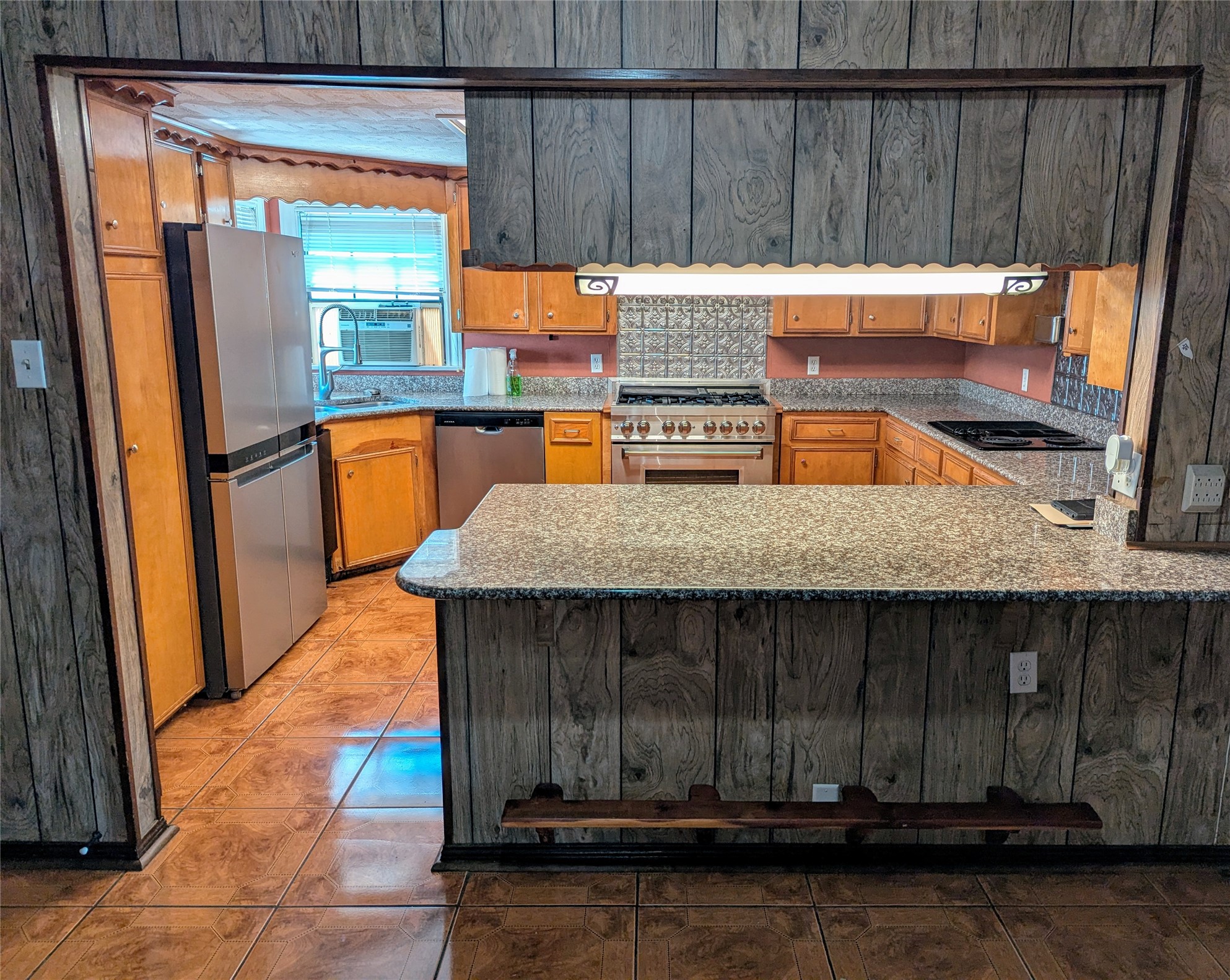 2654 Cos Street Liberty, TX 77575 - Photo 17 of 40 a kitchen with a wooden floor
