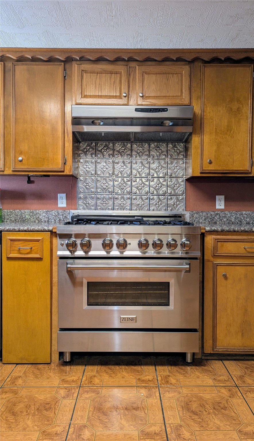 2654 Cos Street Liberty, TX 77575 - Photo 19 of 40 a stove top oven sitting inside of a kitchen