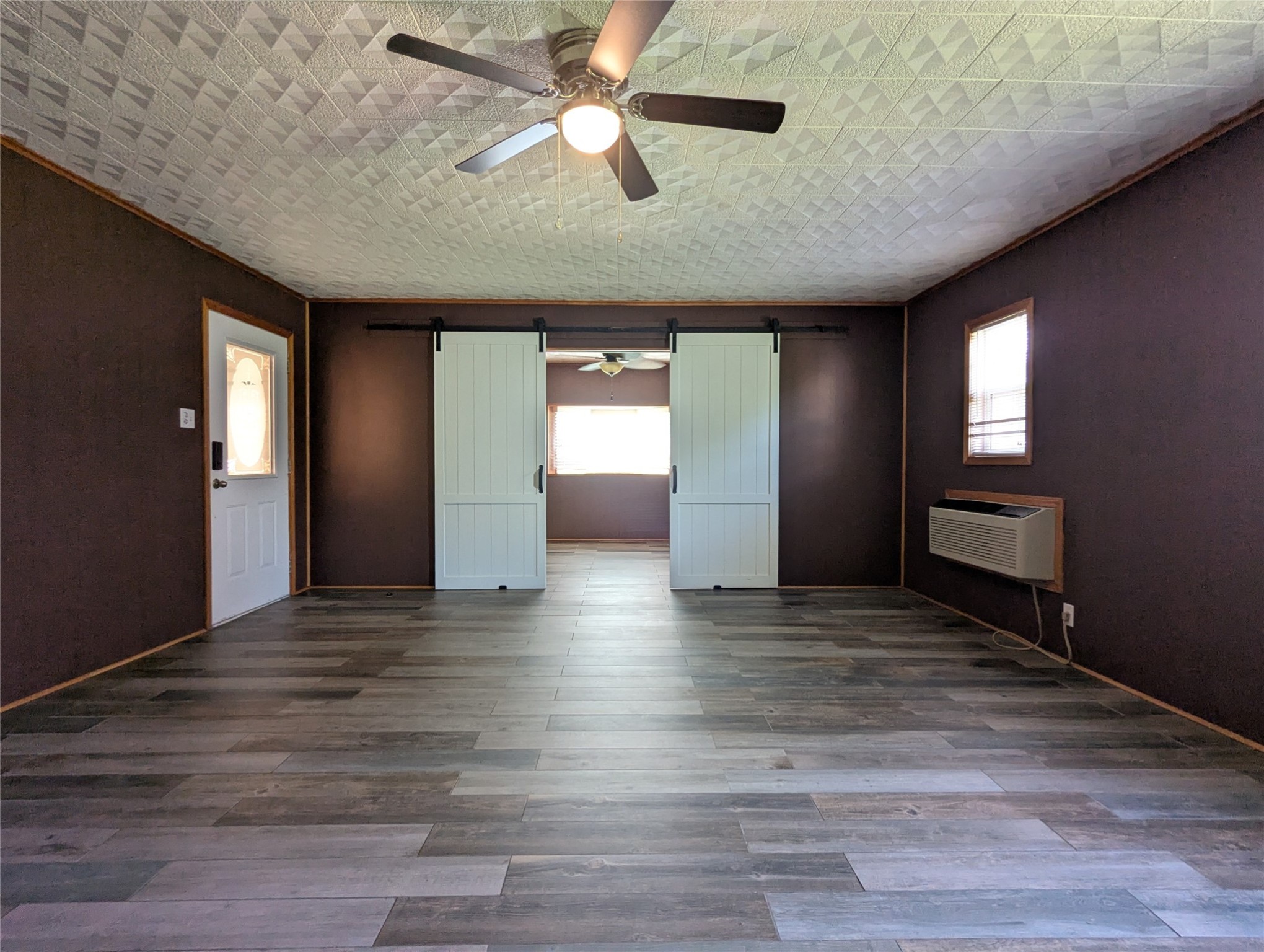 2654 Cos Street Liberty, TX 77575 - Photo 25 of 40 a view of an empty room with window and wooden floor