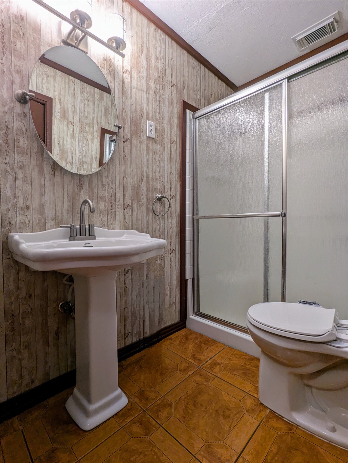 2654 Cos Street Liberty, TX 77575 - Photo 30 of 40 a bathroom with a sink toilet and shower