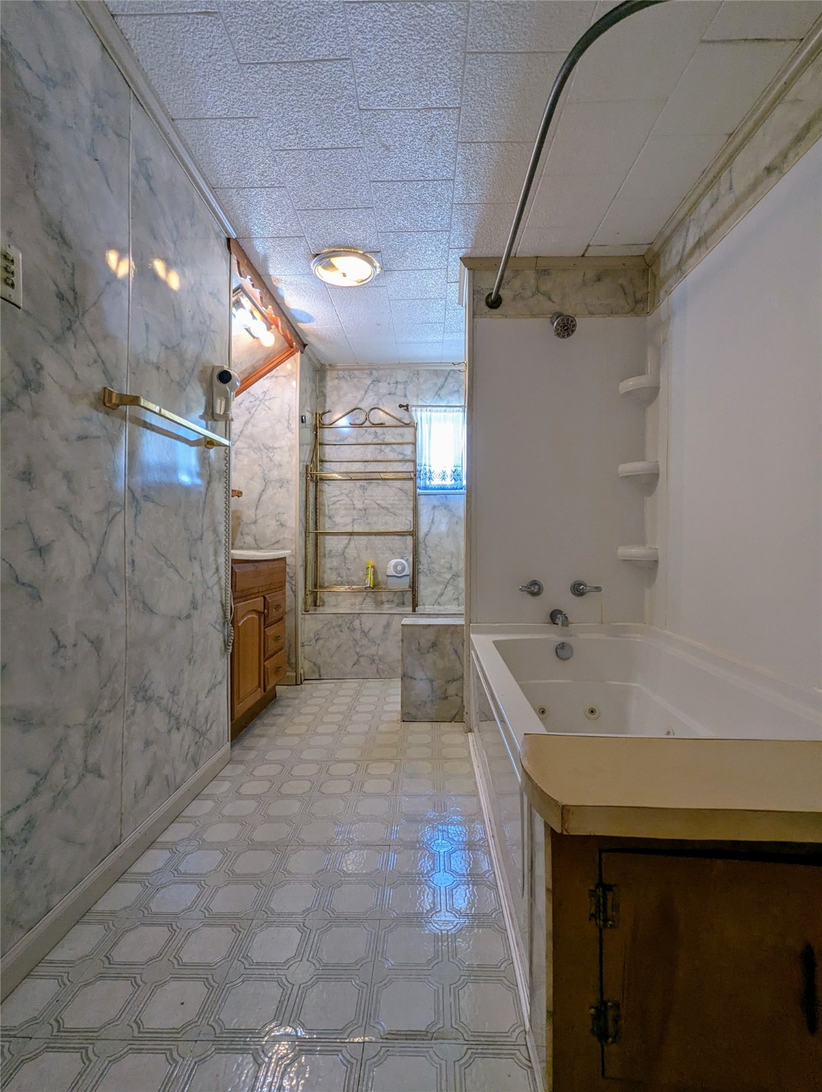 2654 Cos Street Liberty, TX 77575 - Photo 33 of 40 a bathroom with a tub a sink and a shower