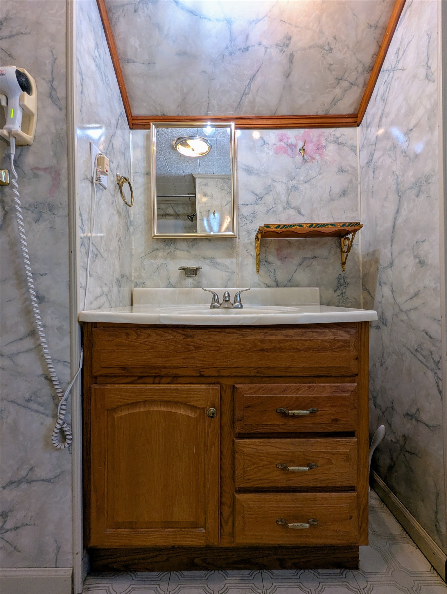 2654 Cos Street Liberty, TX 77575 - Photo 34 of 40 a bathroom with a sink and a mirror