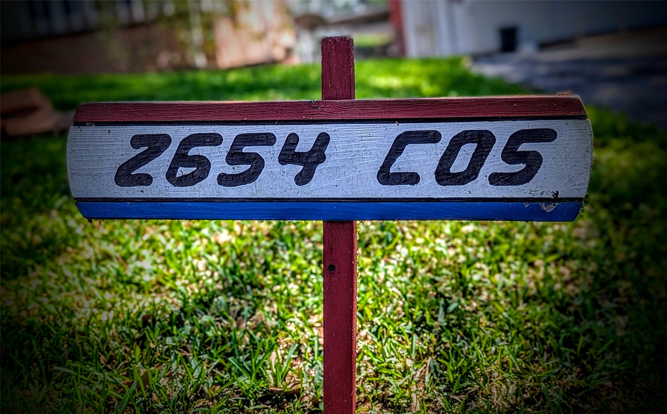 2654 Cos Street Liberty, TX 77575 - Photo 40 of 40 a street sign that is sitting on a brick wall