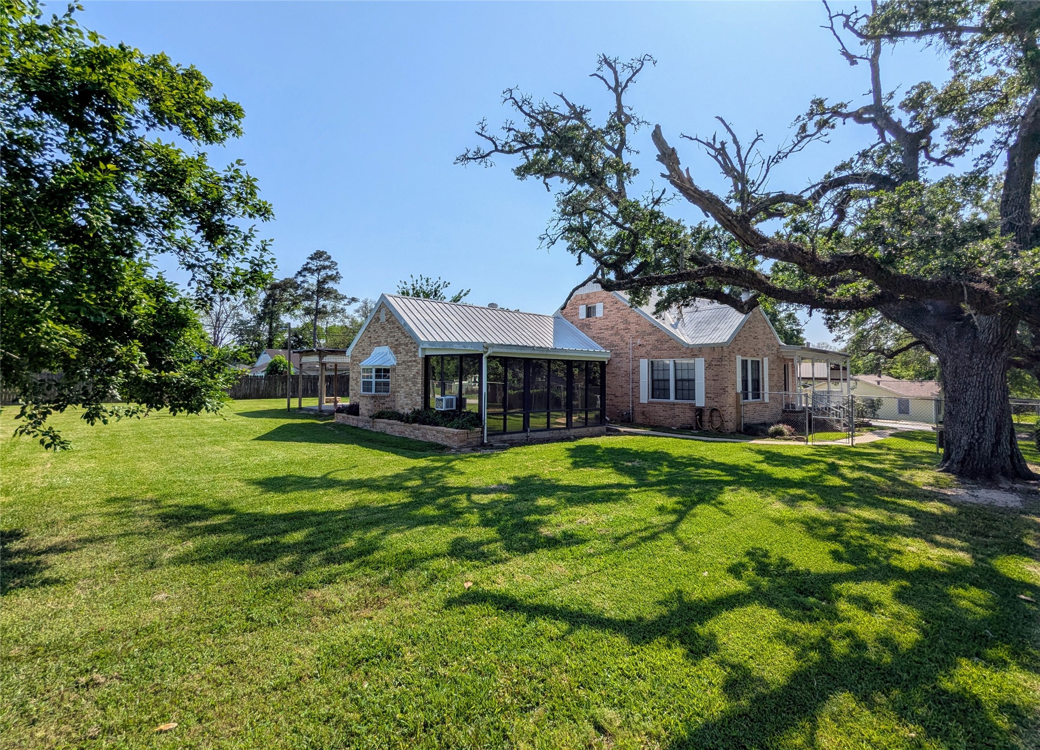 2654 Cos Street Liberty, TX 77575 - Photo 7 of 40 a front view of a house with yard and green space