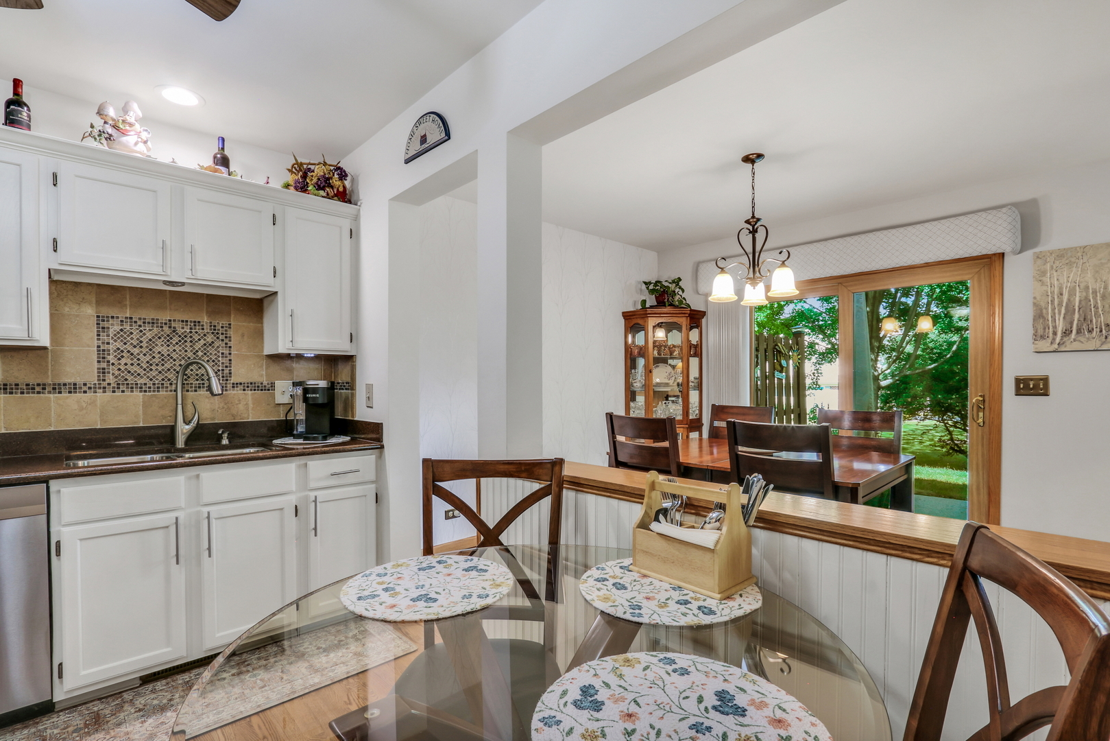 2101 Peach Tree Lane Algonquin, IL 60102 - Photo 12 of 24 a kitchen with stainless steel appliances kitchen island granite countertop a sink and white cabinets
