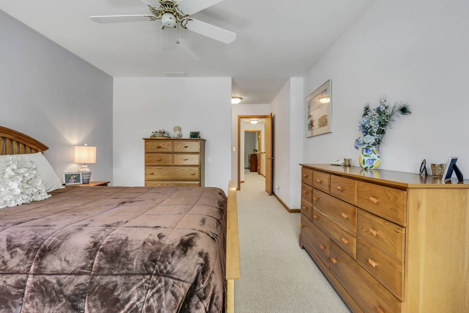 2101 Peach Tree Lane Algonquin, IL 60102 - Photo 17 of 24 a spacious bedroom with a bed and a dresser