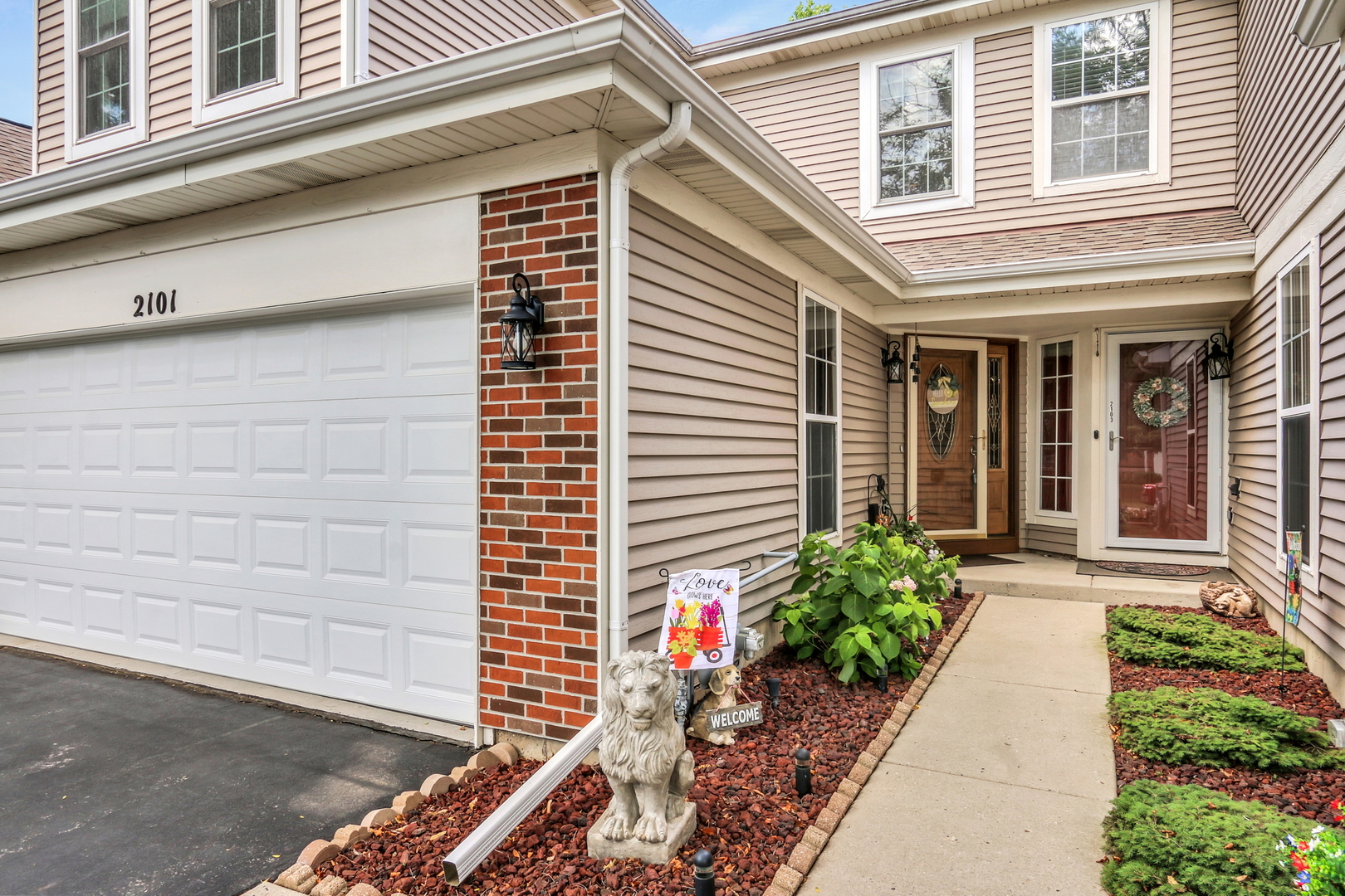 2101 Peach Tree Lane Algonquin, IL 60102 - Photo 2 of 24 a view of a house with potted plants
