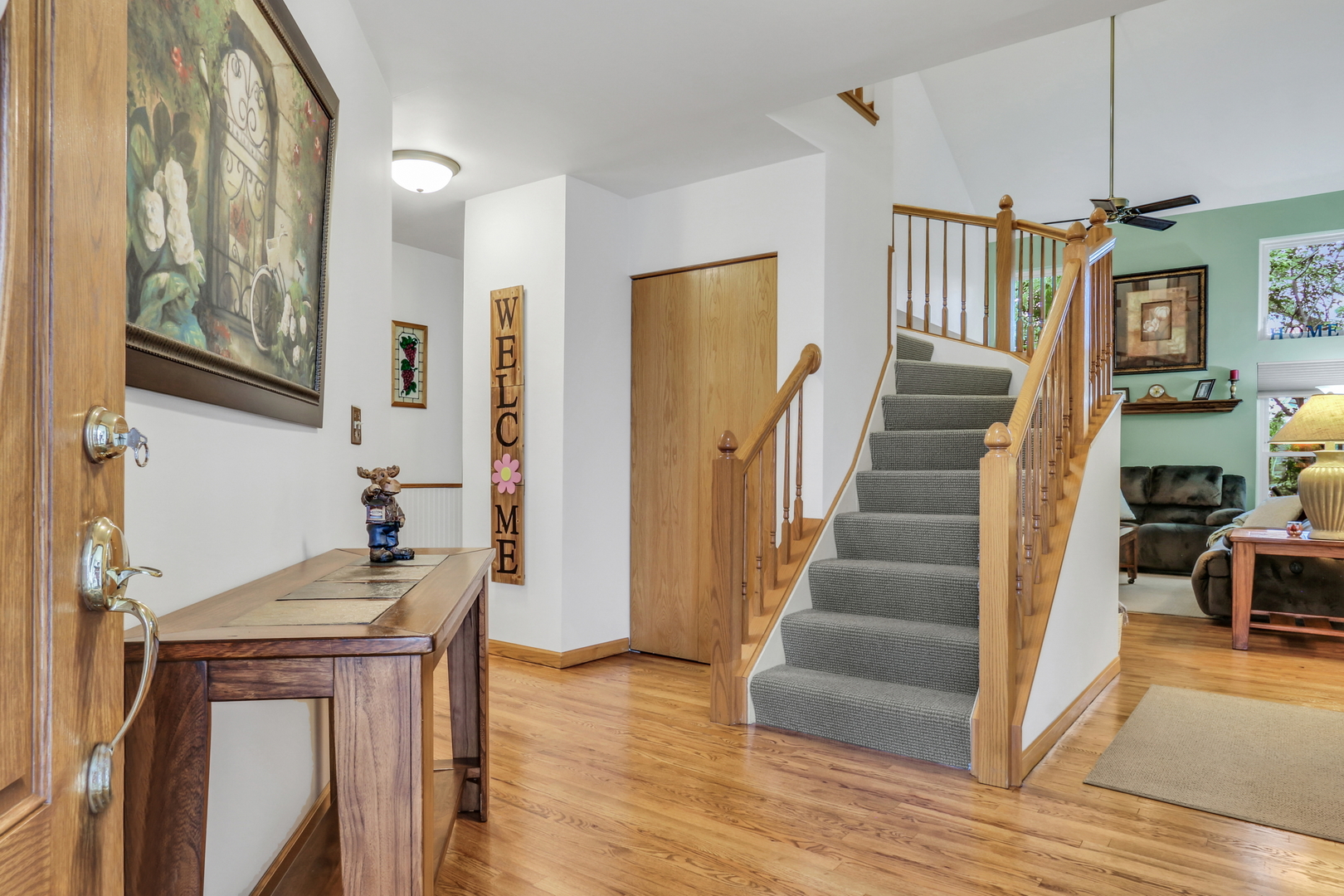 2101 Peach Tree Lane Algonquin, IL 60102 - Photo 4 of 24 a view of entryway and hall with wooden floor