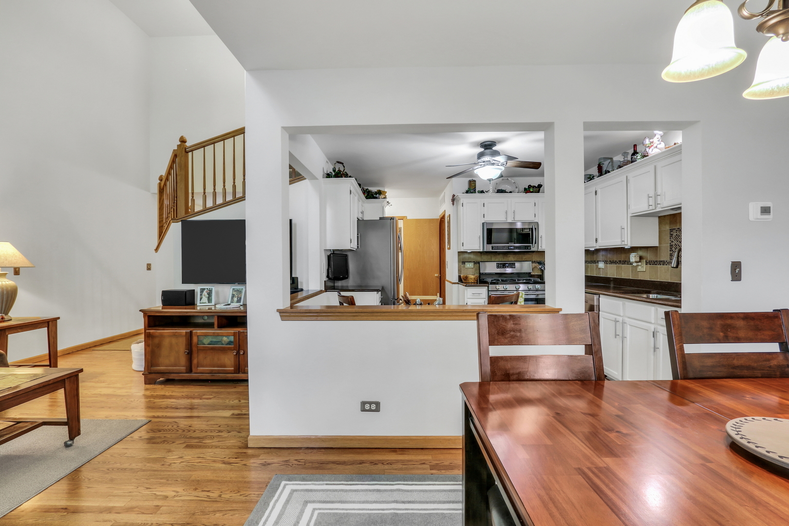 2101 Peach Tree Lane Algonquin, IL 60102 - Photo 10 of 24 a kitchen with stainless steel appliances kitchen island granite countertop a stove and a refrigerator