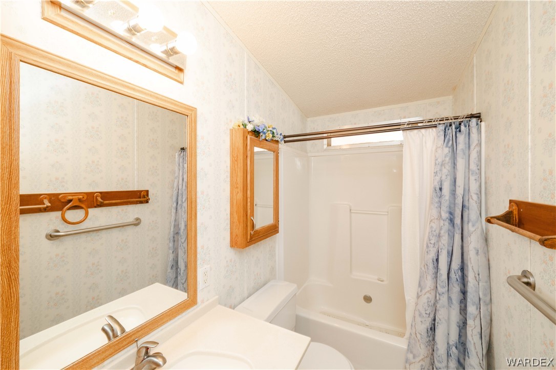 3003 Hualapai Mountain Road Kingman, AZ 86401 - Photo 26 of 49 a bathroom with a shower and a sink