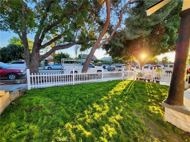 a view of a pathway of a house with a garden