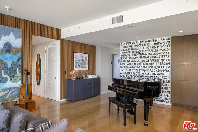 a bedroom with a large bed and a large window