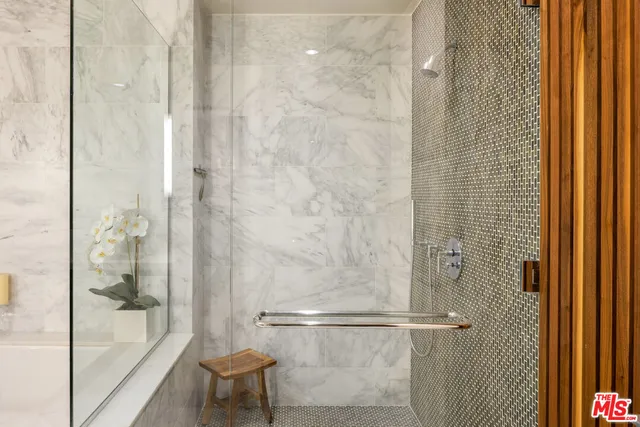 a bathroom with a bathtub and shower