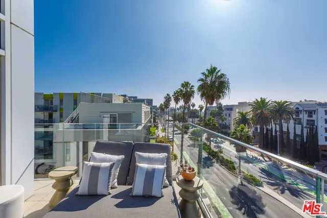 a view of a balcony with potted plants