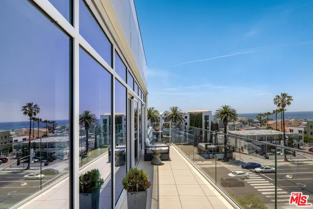 a view of a balcony with chairs