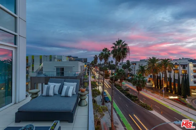 a view of a city street from a balcony