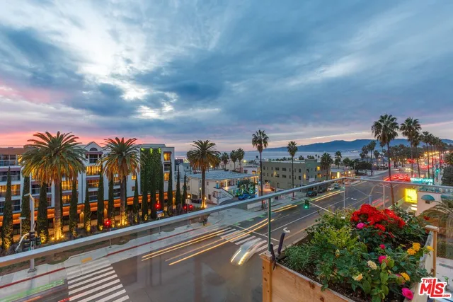 a view of houses with a street